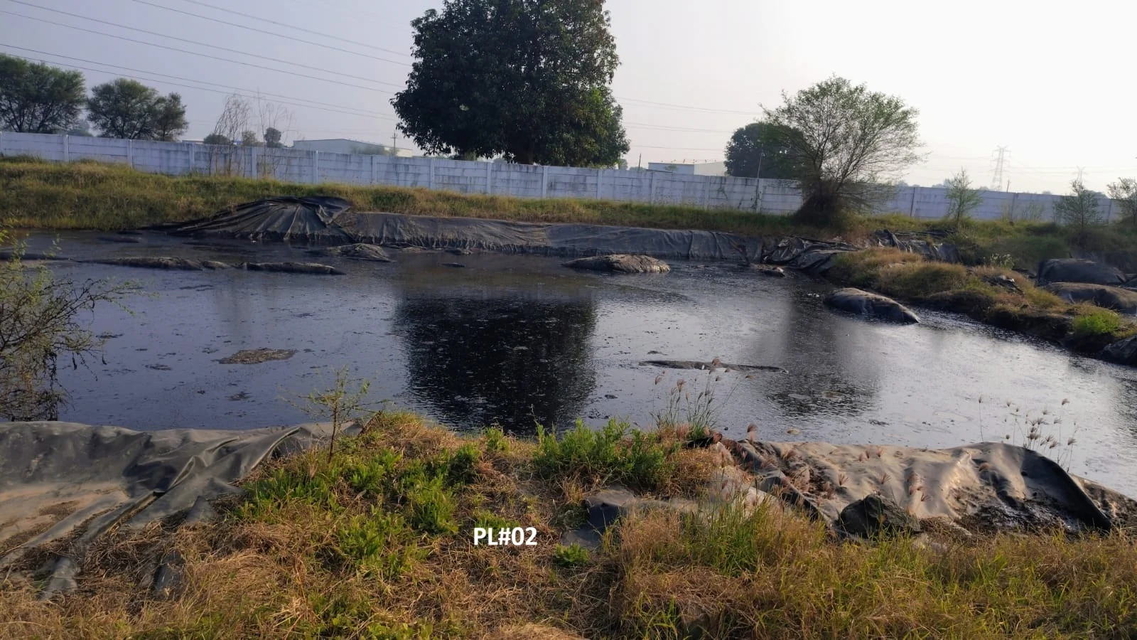 Industrial refinery with stacks—scale and environmental stewardship context for E&P waste management